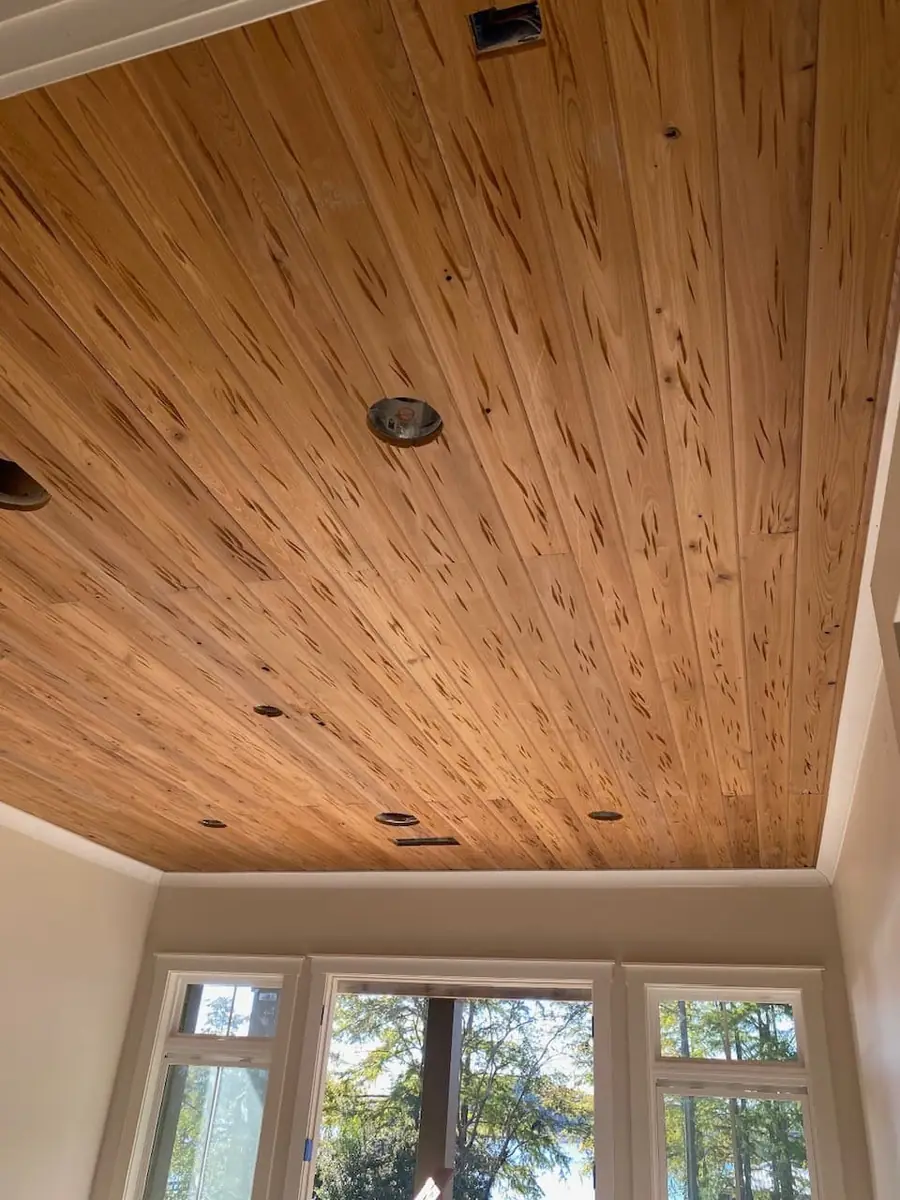 Pecky cypress boards with natural pocketed character grain