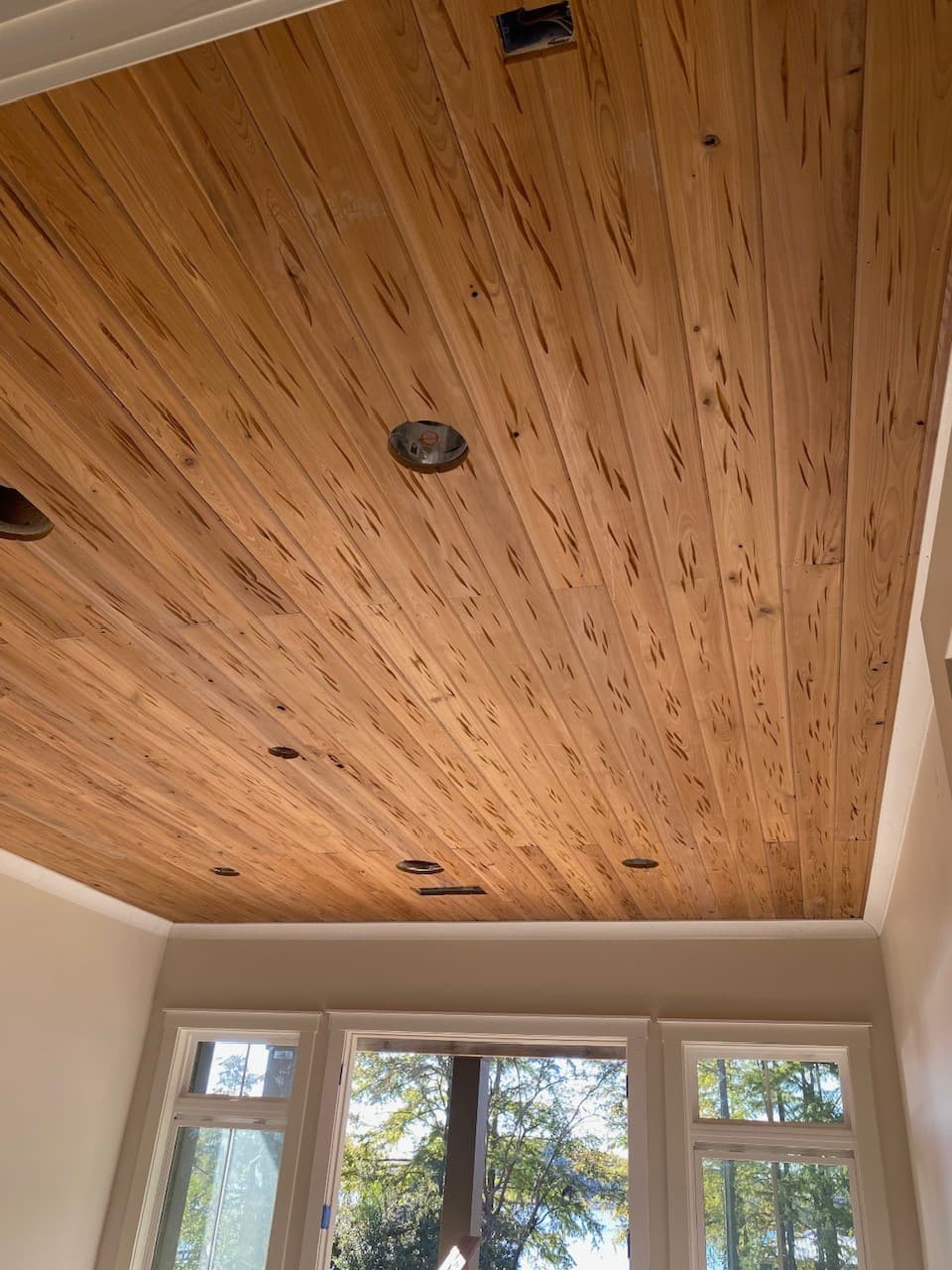 Pecky cypress boards with natural pocketed character grain