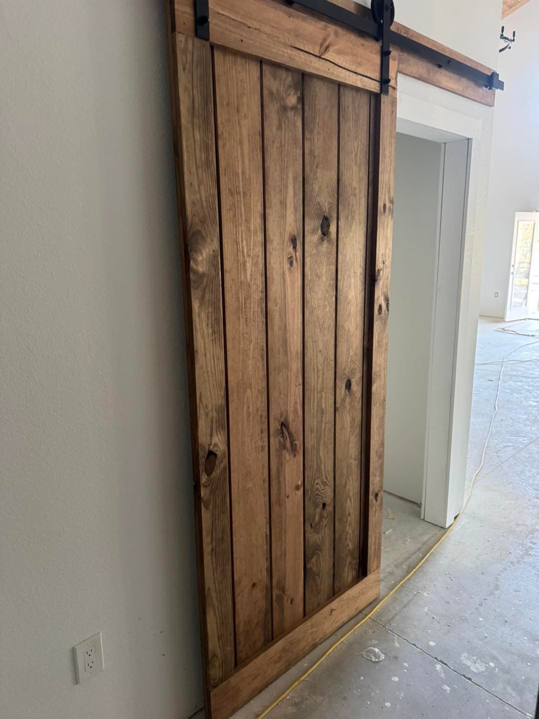 Custom pine barn door built from tongue and groove boards