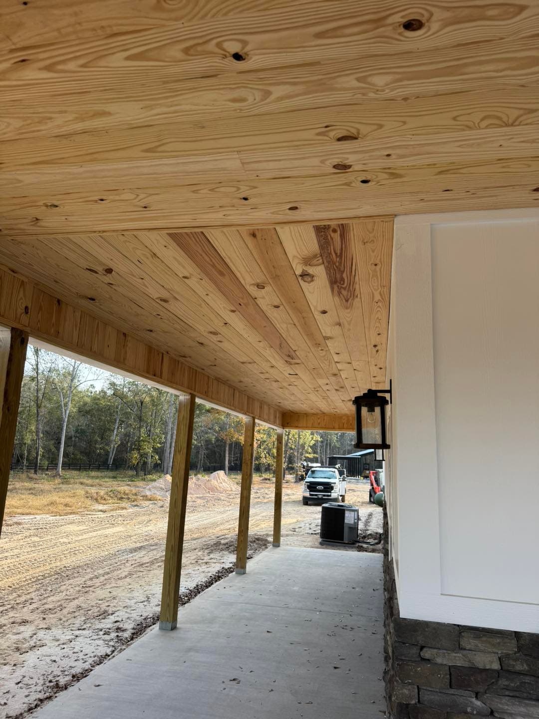 Tongue and groove boards installed on a new construction porch ceiling