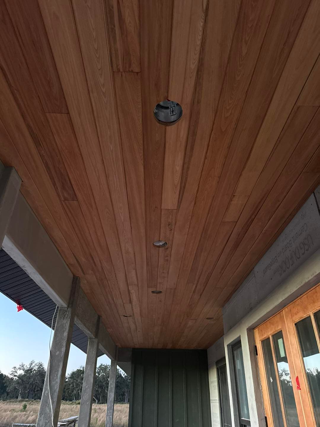 Cypress tongue and groove installed on a covered porch ceiling
